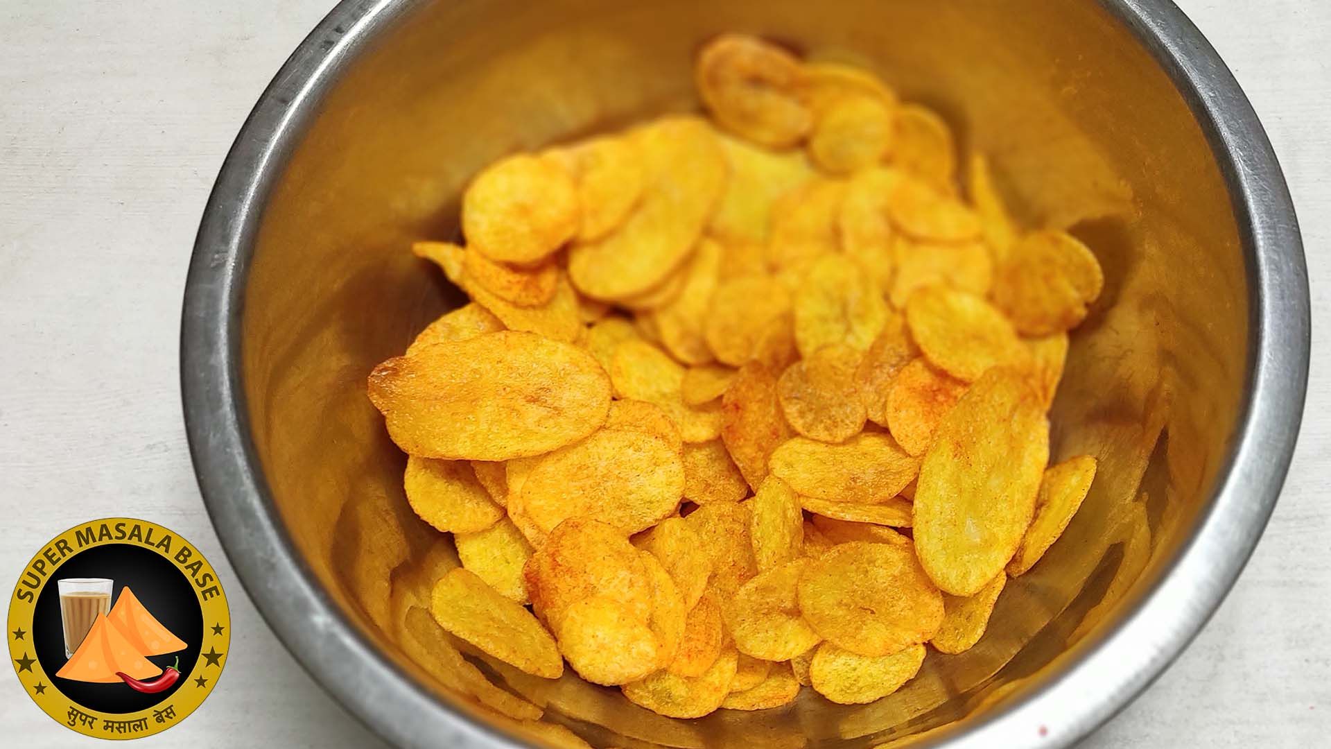 kurkure aloo chips crispy potato waffers in metal bowl