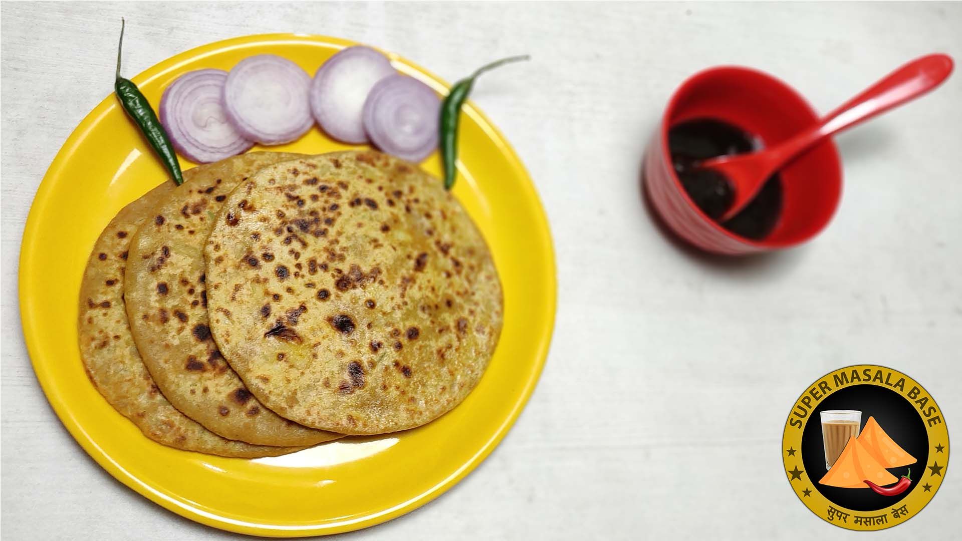 punjabi style potato stuffed aloo paratha in yellow plate